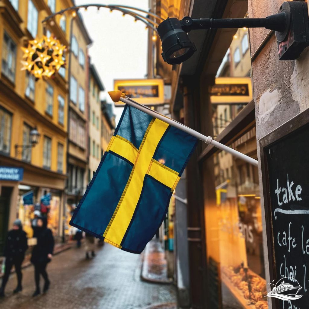 Flag of Sweden Hanging on a Building of a Cafe in an Alley